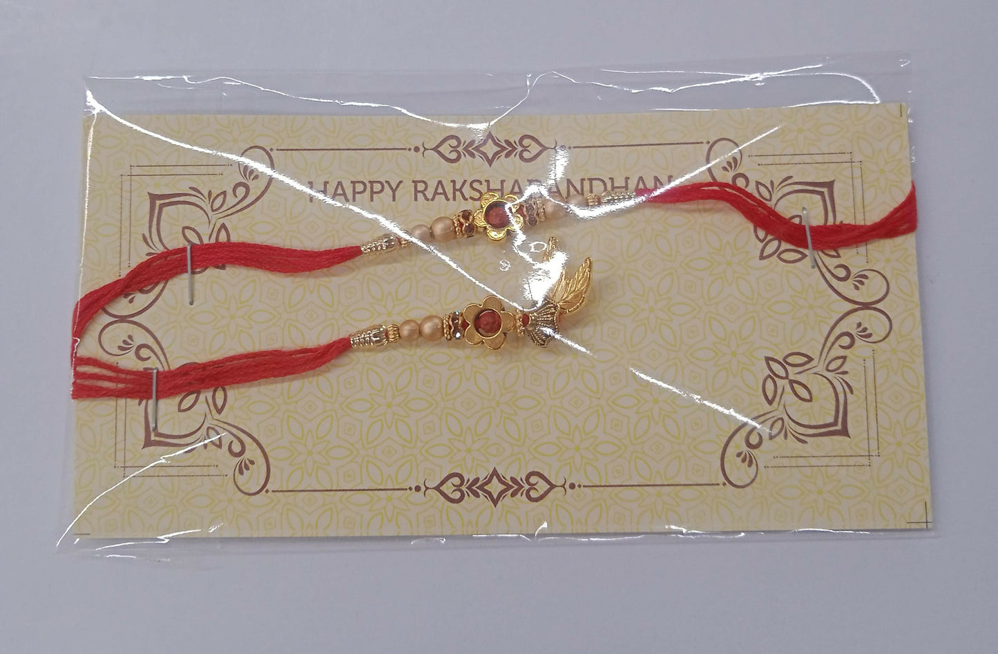Bhaiya Bhabhi Rakhi Set With Golden Leaf Charm And Pearl Beads On Red Thread
