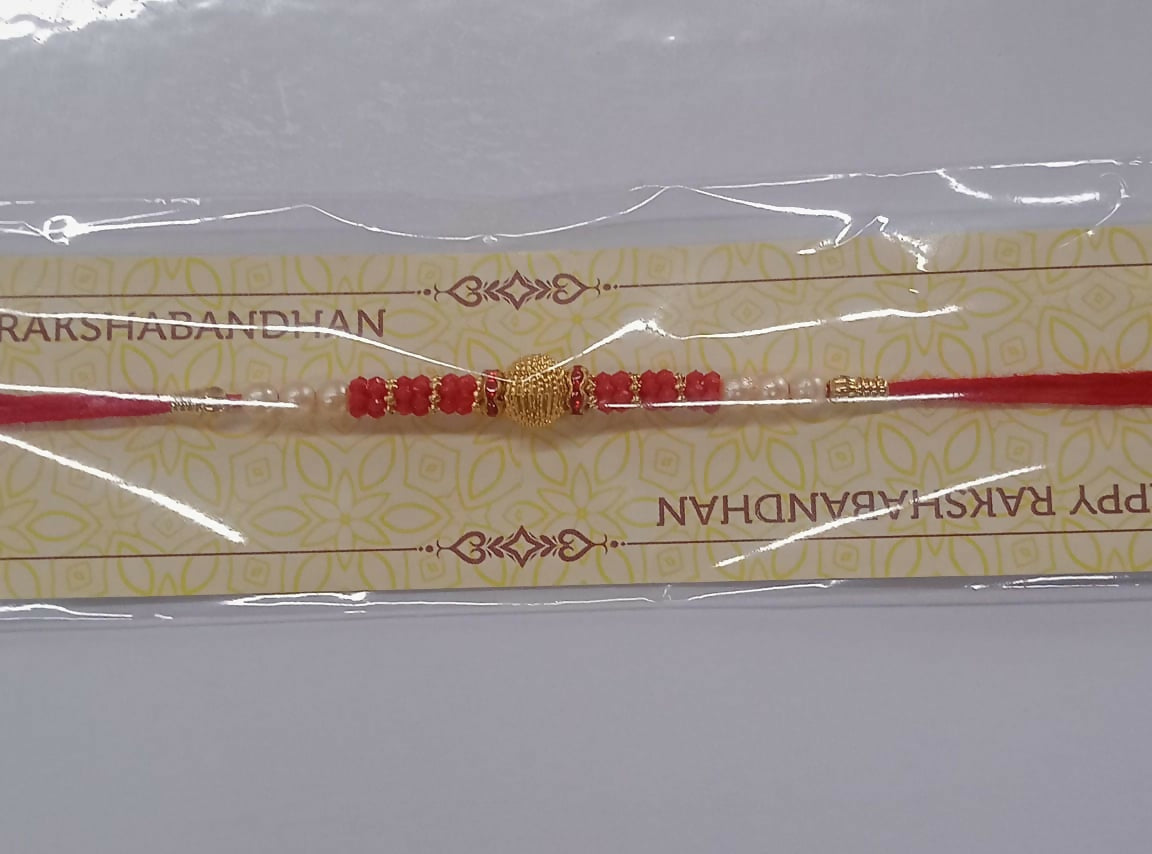 Classic Red Bead Rakhi With Central Golden Textured Bead And Pearl Accents Elegant Raksha Bandhan Thread For Brother