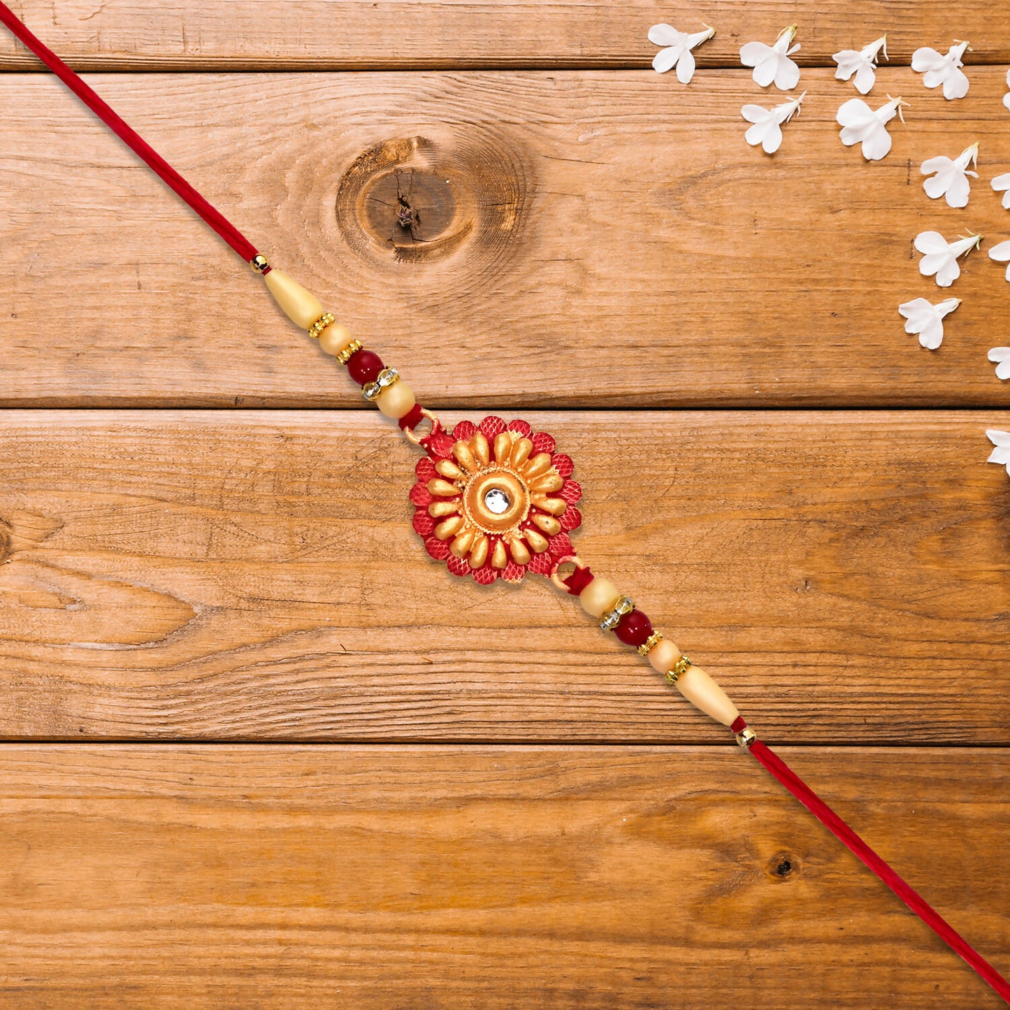 Traditional Bhaiya Rakhi With Floral Centerpiece White Beads And Stone Accent On Red Thread