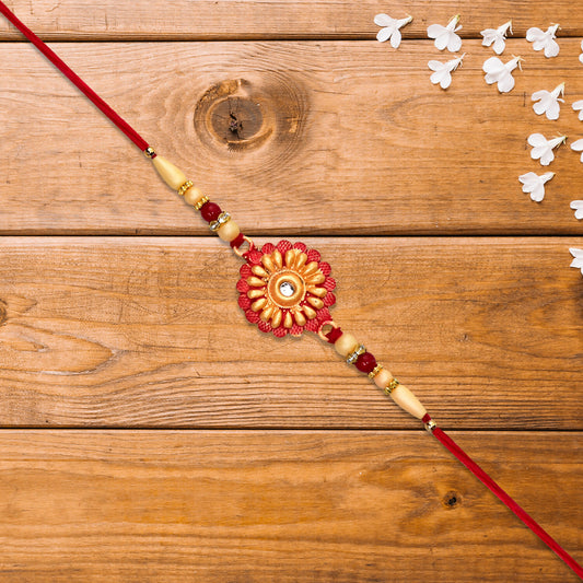 Traditional Bhaiya Rakhi With Floral Centerpiece White Beads And Stone Accent On Red Thread