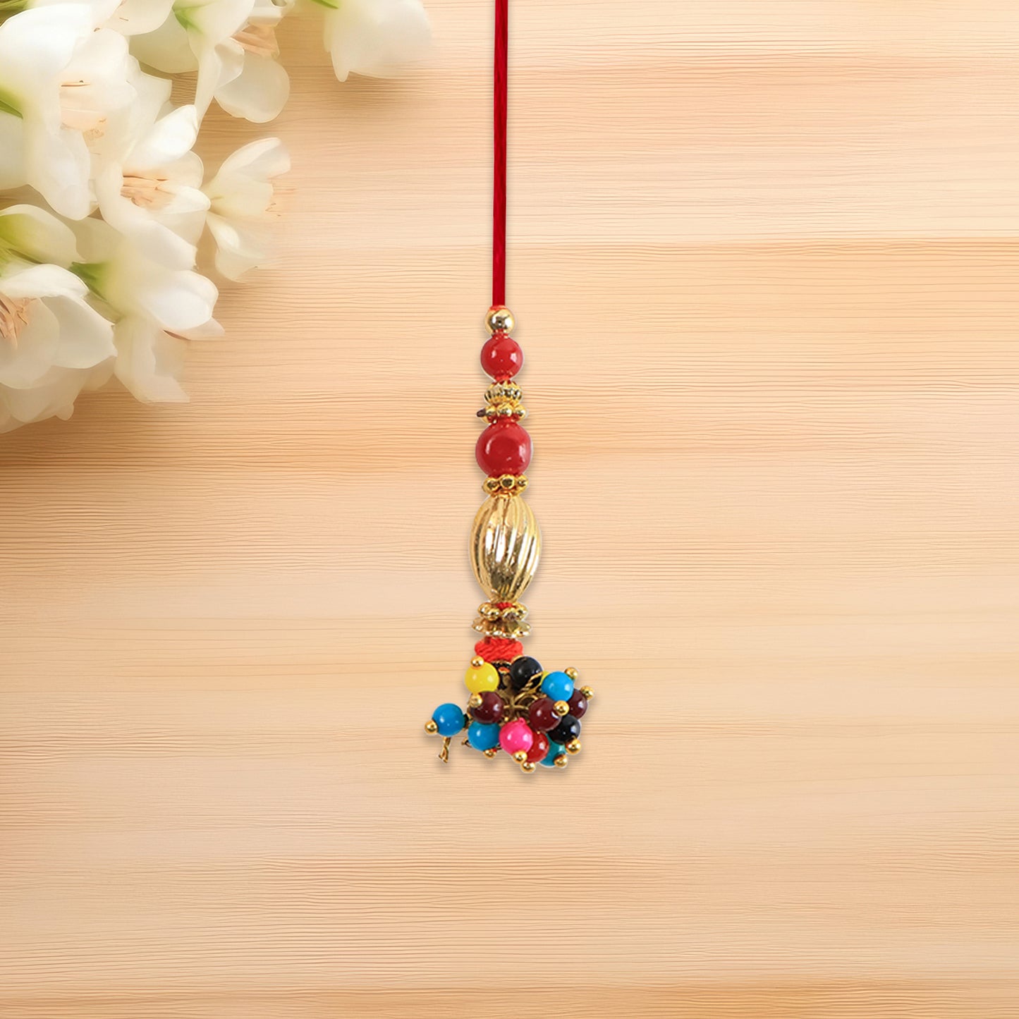 Bhabhi Lumba Rakhi With Multicolor Beads And Golden Floral Charm On Red Thread