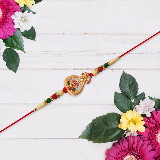 Designer Rakhi With Veena And Flower Charm